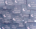 Label "TO THE MOON AND BACK"