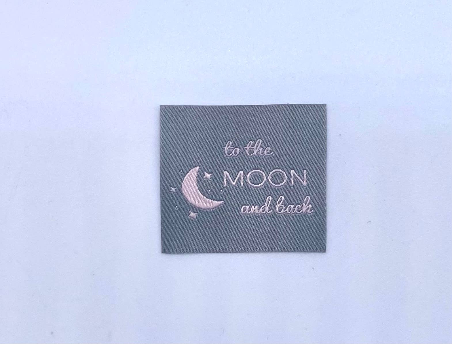 Label "TO THE MOON AND BACK"
